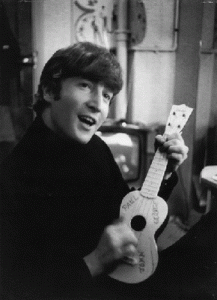 Johnl Lennon playing a ukelele